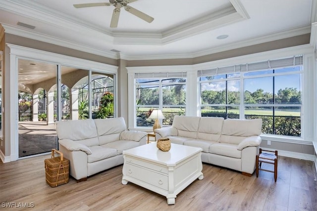 sunroom / solarium featuring ceiling fan and a tray ceiling