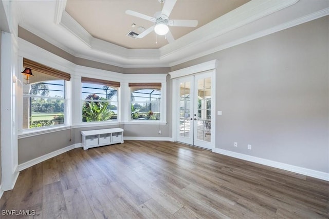 unfurnished room featuring hardwood / wood-style floors, french doors, ceiling fan, and crown molding