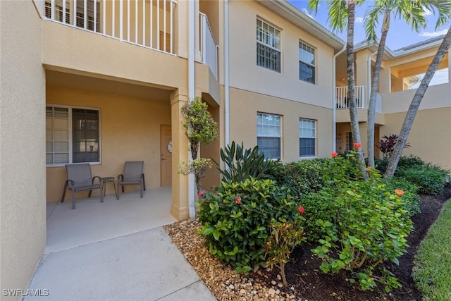 exterior space featuring a patio area and a balcony