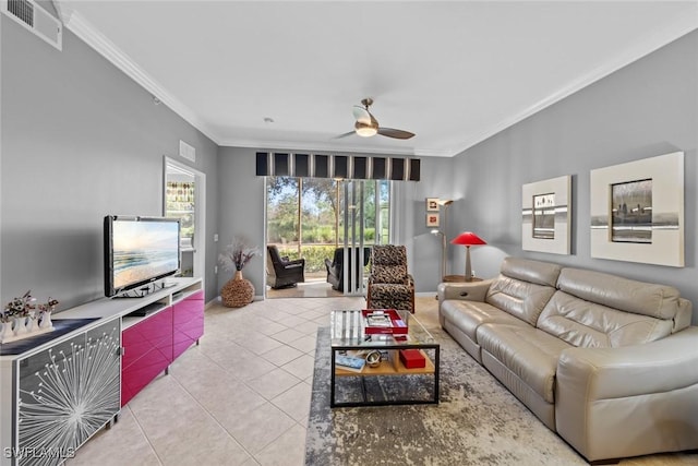 tiled living room with ceiling fan and ornamental molding