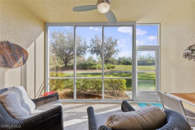 sunroom with a wealth of natural light and ceiling fan