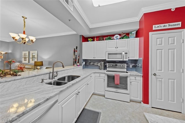 kitchen featuring a notable chandelier, white cabinetry, white appliances, and sink