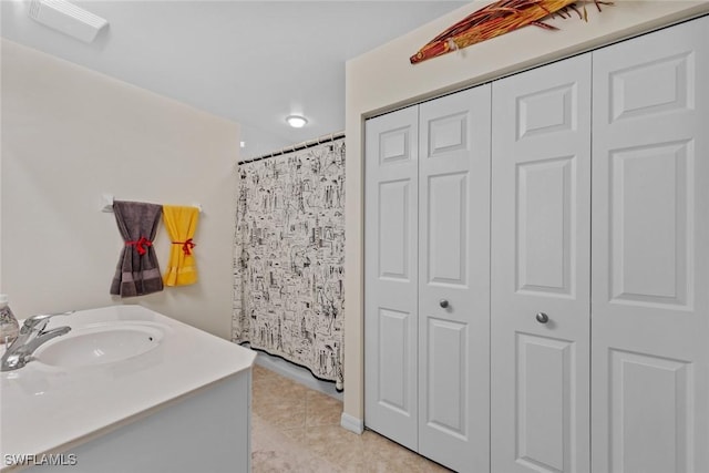 bathroom featuring tile patterned floors and vanity