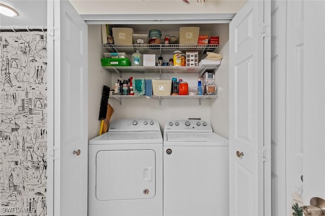 clothes washing area featuring washer and dryer