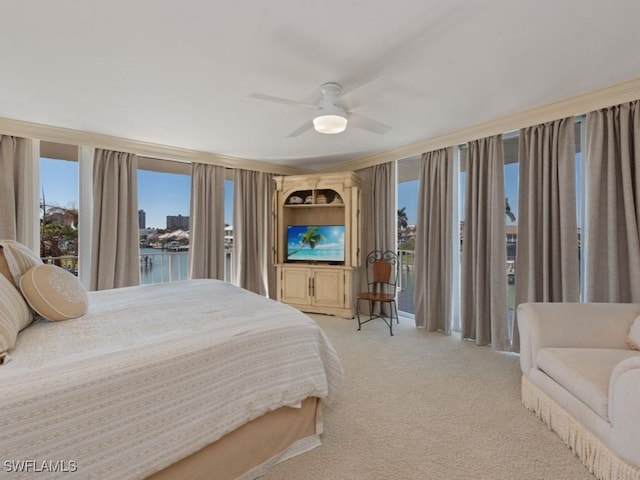 bedroom featuring light colored carpet and ceiling fan