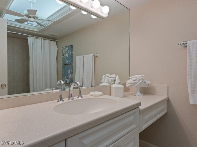 bathroom featuring ceiling fan and vanity