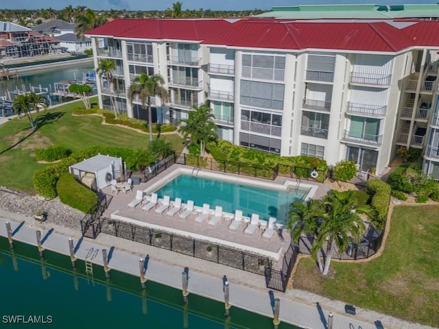 view of swimming pool featuring a water view