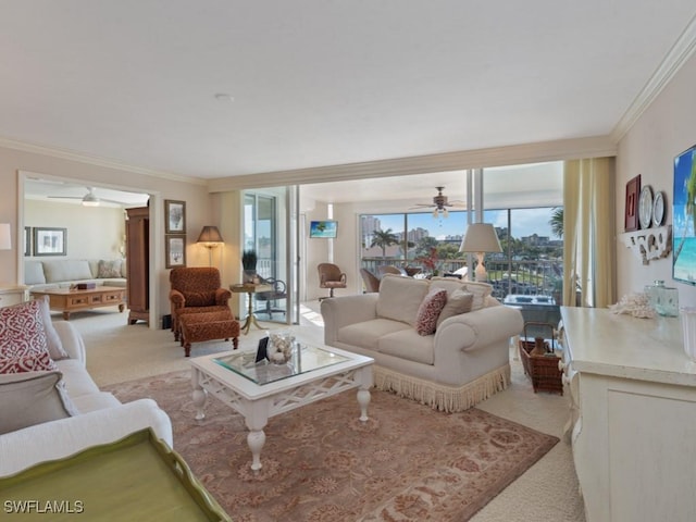 carpeted living room featuring ceiling fan and crown molding