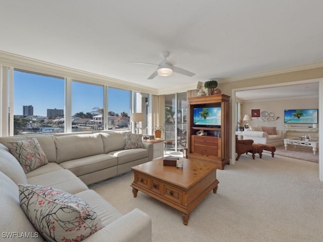 living room featuring ceiling fan, ornamental molding, and light carpet