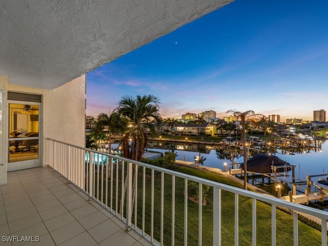 balcony at dusk with a water view