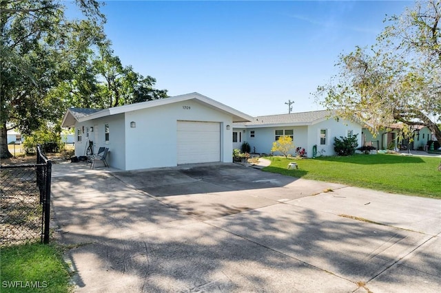 single story home featuring a garage and a front yard