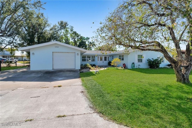 single story home featuring a garage and a front yard