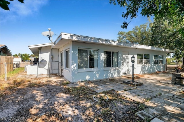 back of house with a patio area