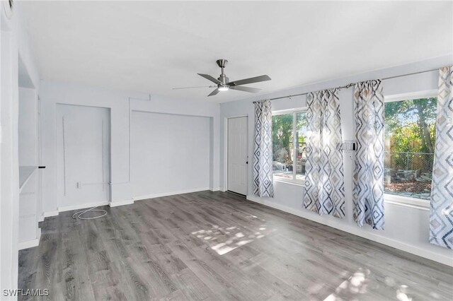 spare room featuring ceiling fan and wood-type flooring