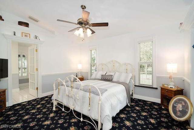 carpeted bedroom with ceiling fan and lofted ceiling