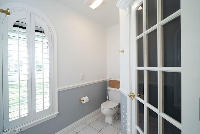 bathroom with tile patterned floors and toilet