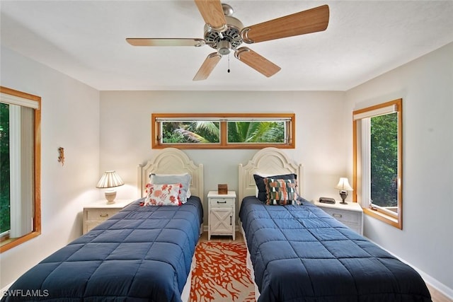 bedroom featuring hardwood / wood-style floors and ceiling fan