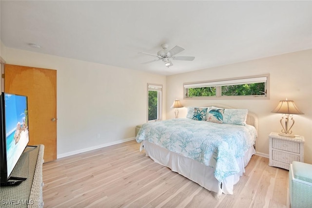 bedroom featuring light hardwood / wood-style floors and ceiling fan