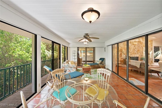 sunroom / solarium with ceiling fan