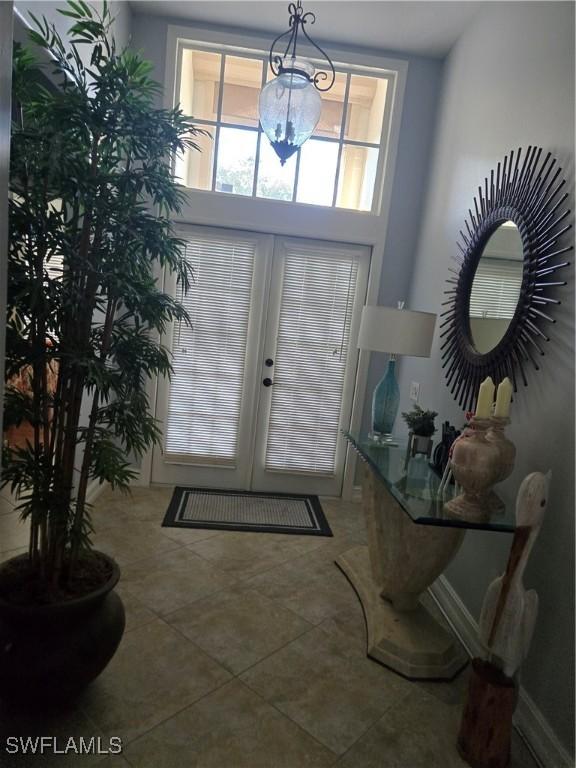 tiled entryway with french doors