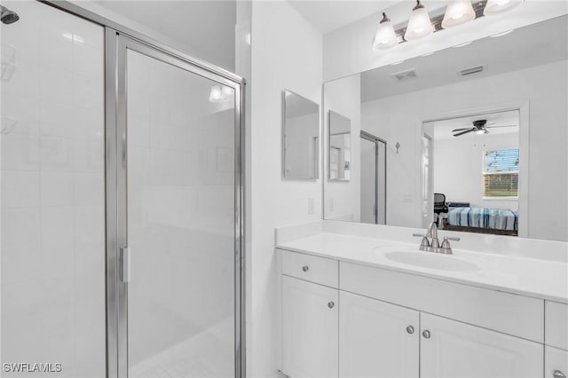 bathroom featuring walk in shower and vanity