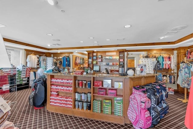 misc room featuring ornamental molding and carpet flooring