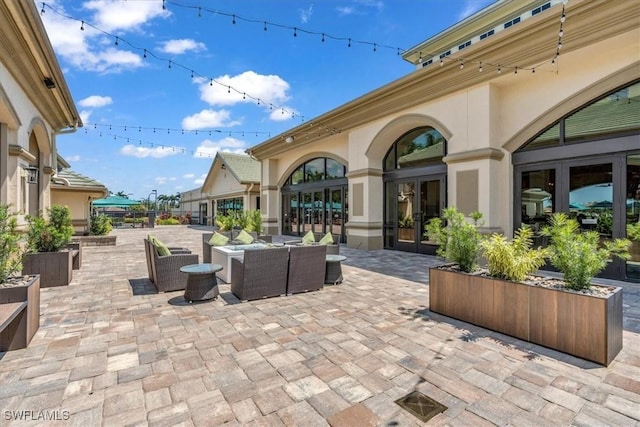 view of patio featuring an outdoor living space and french doors