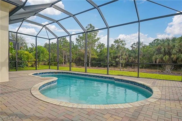 view of pool featuring a lanai and a patio