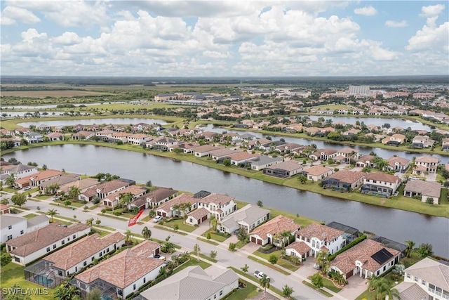 drone / aerial view with a water view