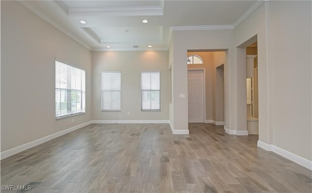 unfurnished room with light hardwood / wood-style floors and ornamental molding