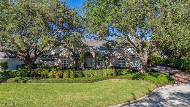 view of front of home with a front lawn