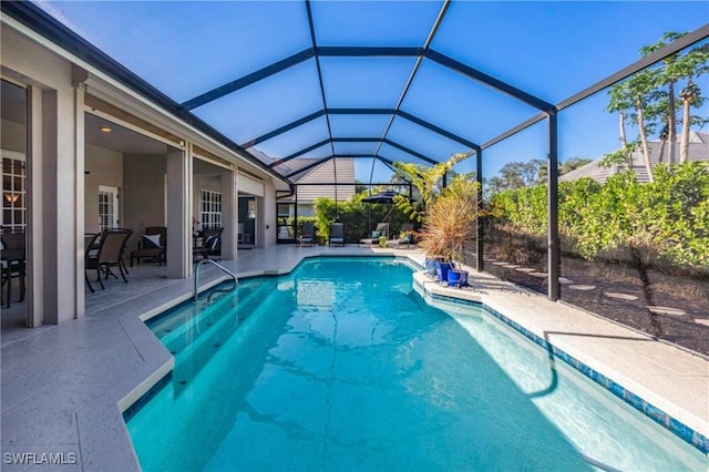 view of pool featuring a lanai and a patio