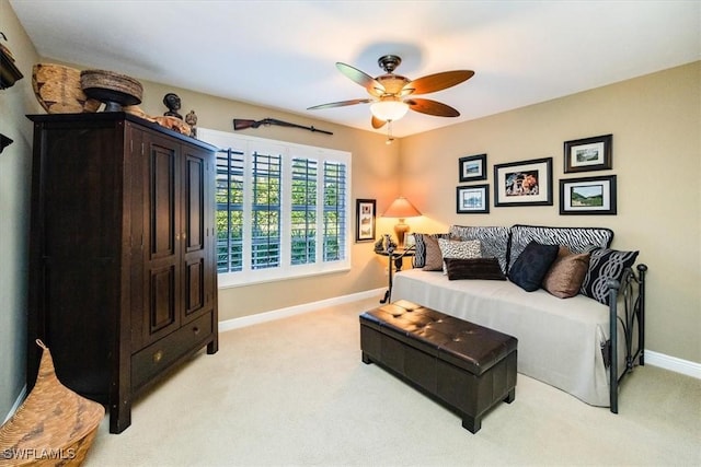 living room with light colored carpet and ceiling fan