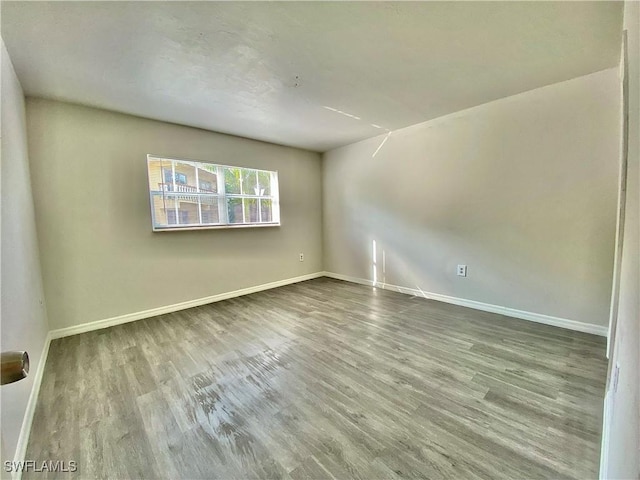 empty room featuring hardwood / wood-style flooring