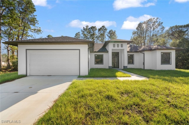 view of front facade featuring a garage and a front lawn