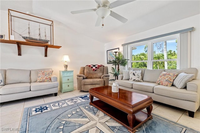 tiled living room featuring ceiling fan and vaulted ceiling