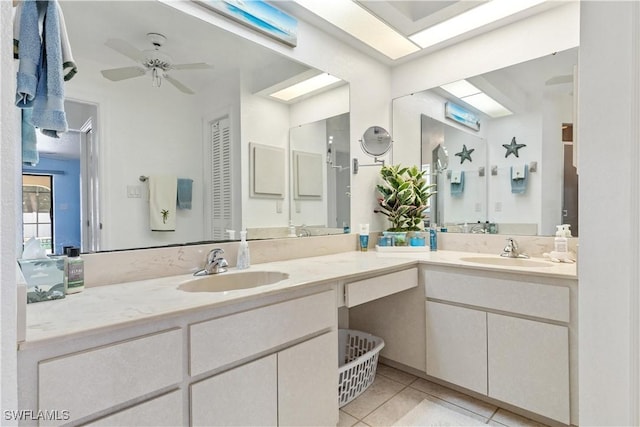 bathroom featuring tile patterned flooring, vanity, and ceiling fan