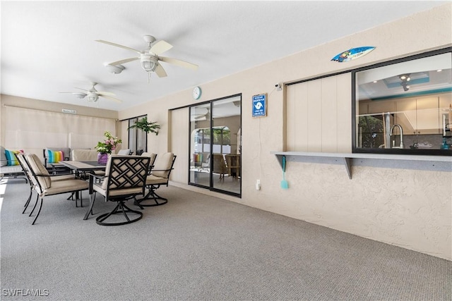 view of patio featuring ceiling fan