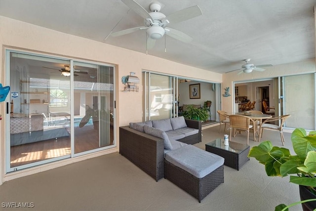 interior space with ceiling fan