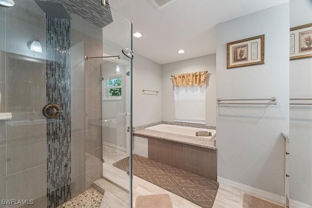 bathroom featuring separate shower and tub and a wealth of natural light