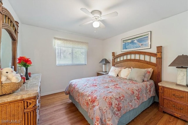 bedroom featuring light wood-type flooring and ceiling fan