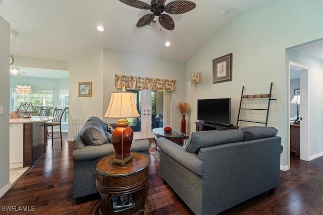 living room featuring dark hardwood / wood-style flooring, vaulted ceiling, and plenty of natural light