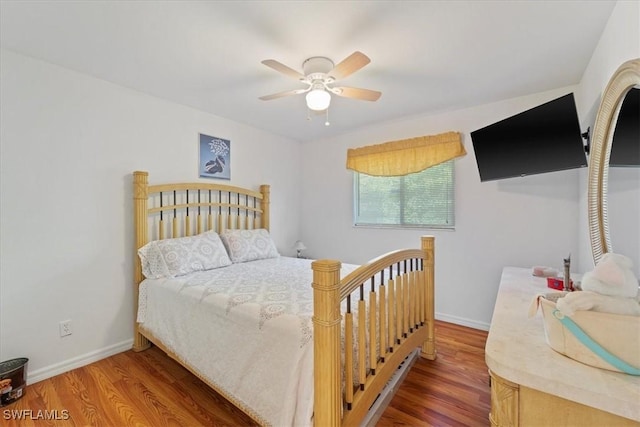 bedroom featuring hardwood / wood-style floors and ceiling fan