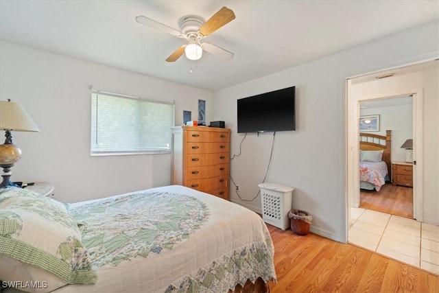 bedroom featuring light hardwood / wood-style floors and ceiling fan