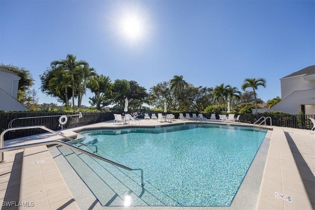 view of swimming pool with a patio area