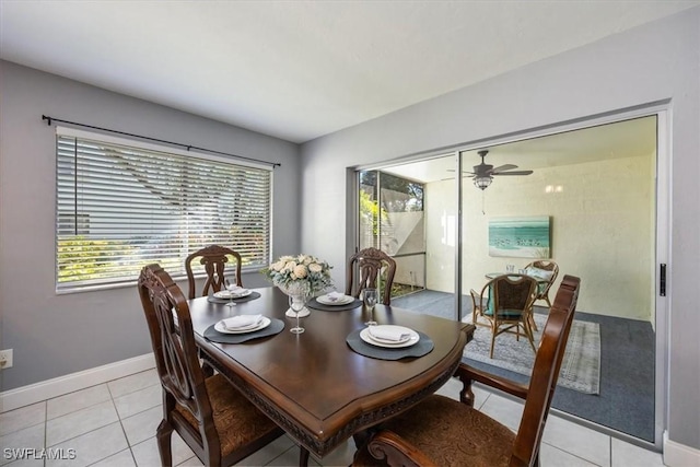 dining space with ceiling fan, plenty of natural light, and light tile patterned floors