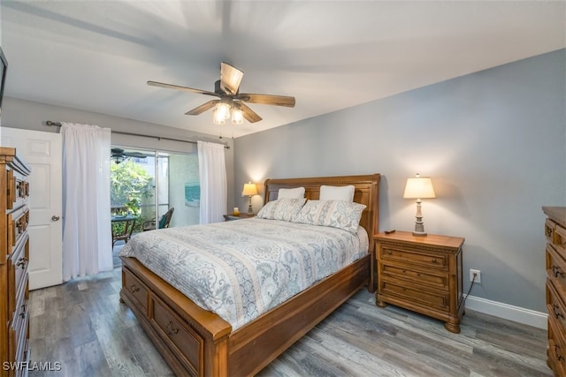 bedroom featuring hardwood / wood-style flooring, ceiling fan, and access to exterior