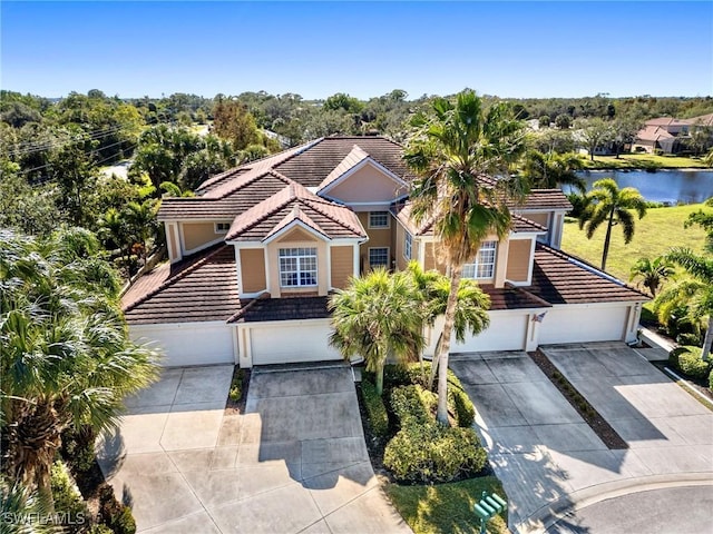 view of front of home featuring a water view and a garage