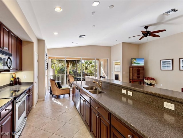 kitchen featuring lofted ceiling, sink, ceiling fan, light tile patterned floors, and stainless steel appliances