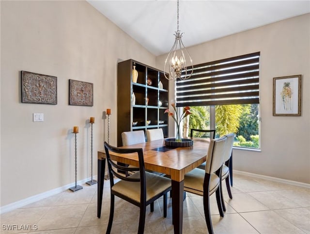 tiled dining space with an inviting chandelier